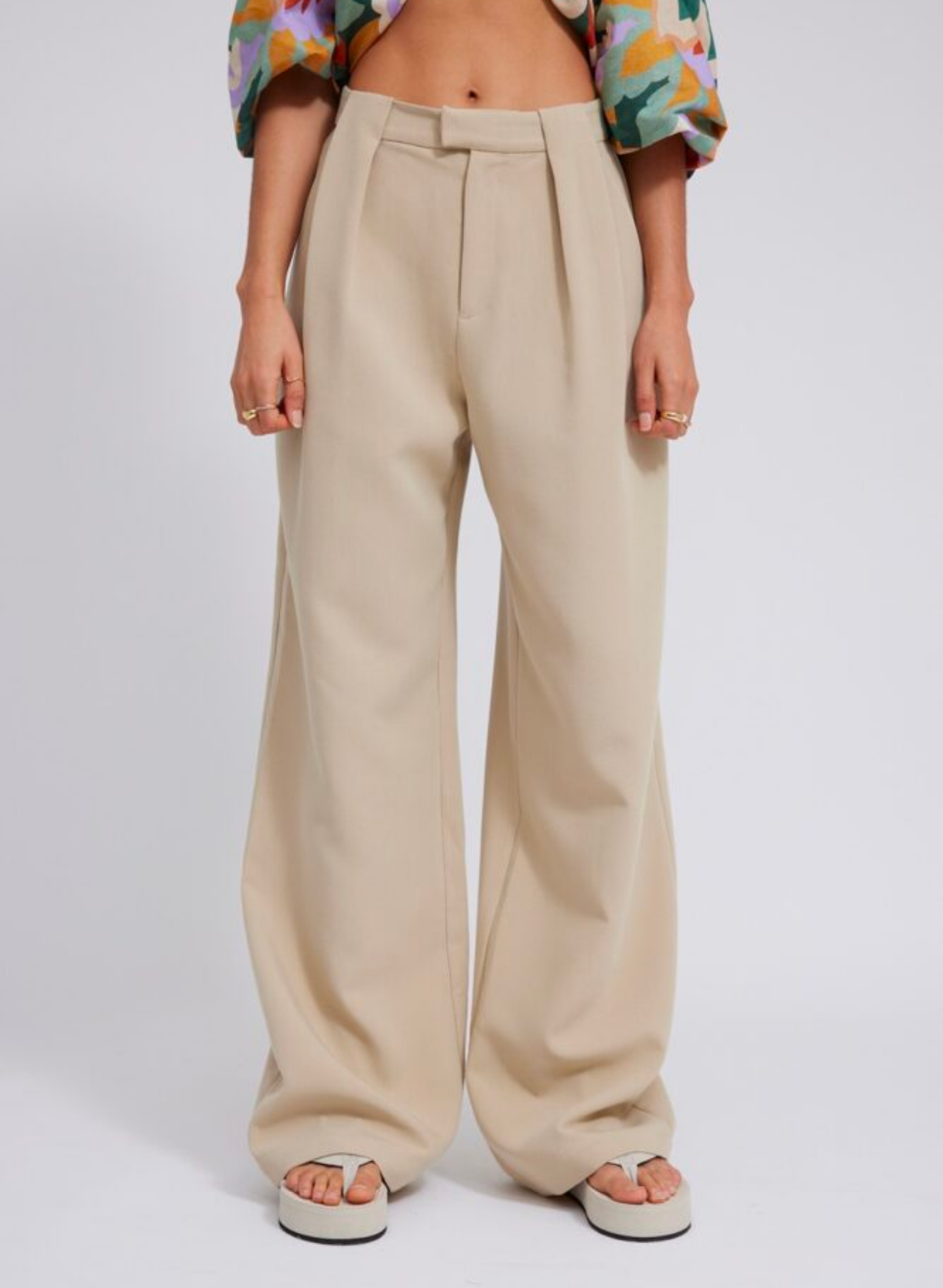Full length slouchy style suit pant Thick suiting fabrication Designed to be a wide straight leg Waist beltloop tuck detail Pant is unlined Composition: 96% Polyester 4% Spandex