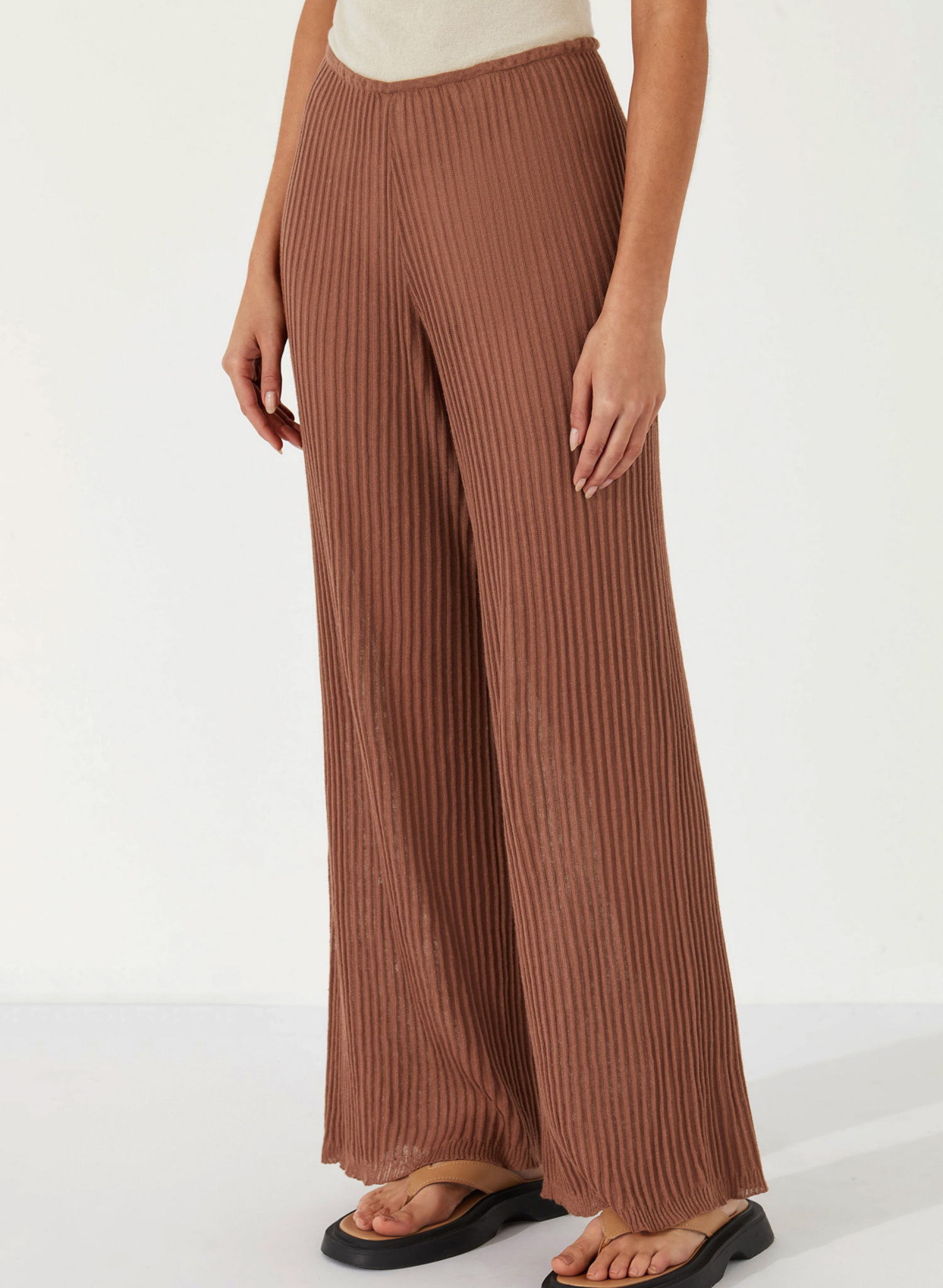 The Ribbed Knit Pant by Zulu & Zephyr is a soft sheer textured piece featuring a wide long leg and thin elasticated waistband for comfort and versatility with fit. Inspired by the drape of tactile cloth and soft organic forms, this transeasonal essential may be paired with the coordinating Ribbed Knit Top - Earth.