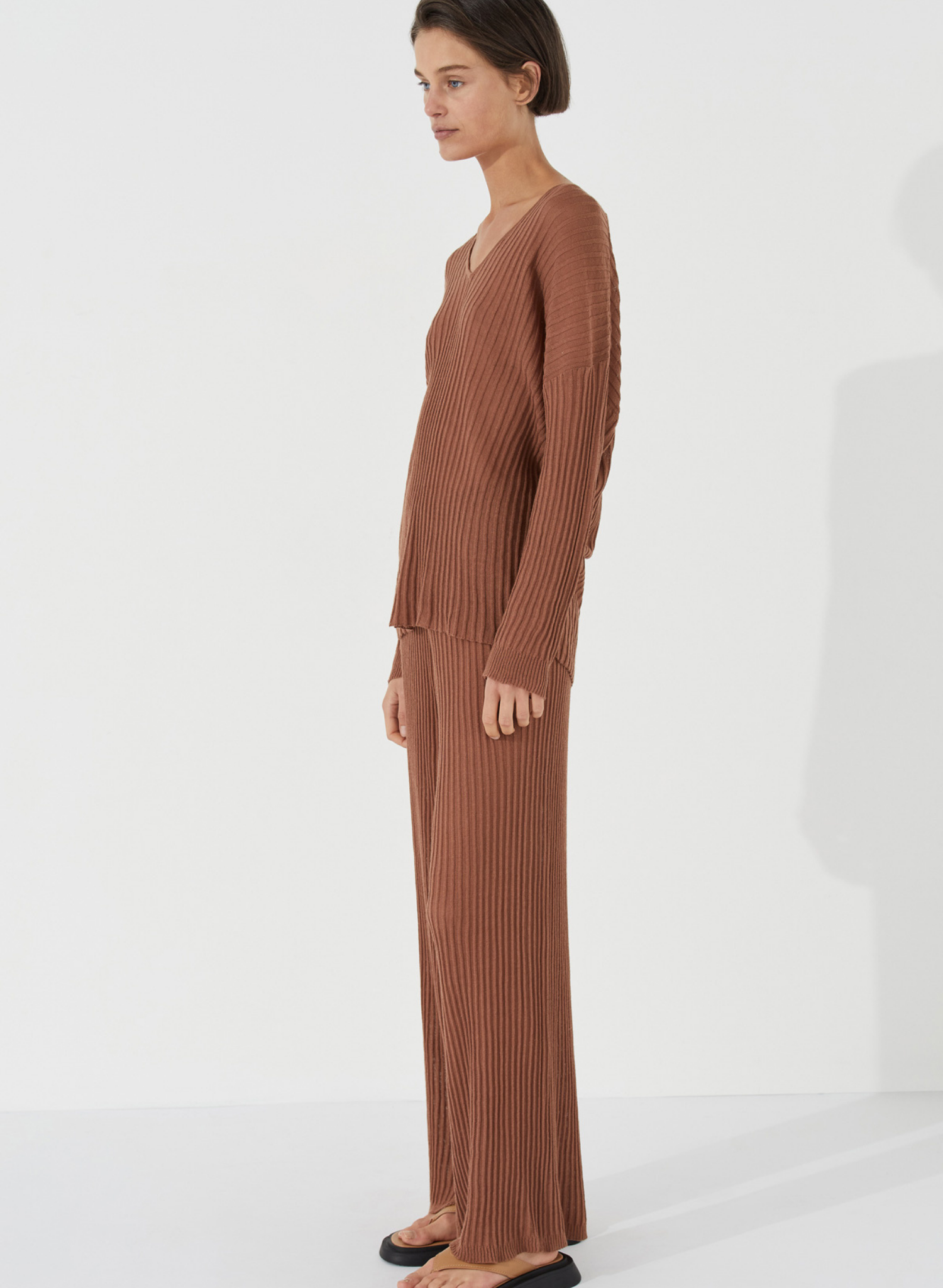 The Ribbed Knit Pant by Zulu & Zephyr is a soft sheer textured piece featuring a wide long leg and thin elasticated waistband for comfort and versatility with fit. Inspired by the drape of tactile cloth and soft organic forms, this transeasonal essential may be paired with the coordinating Ribbed Knit Top - Earth.