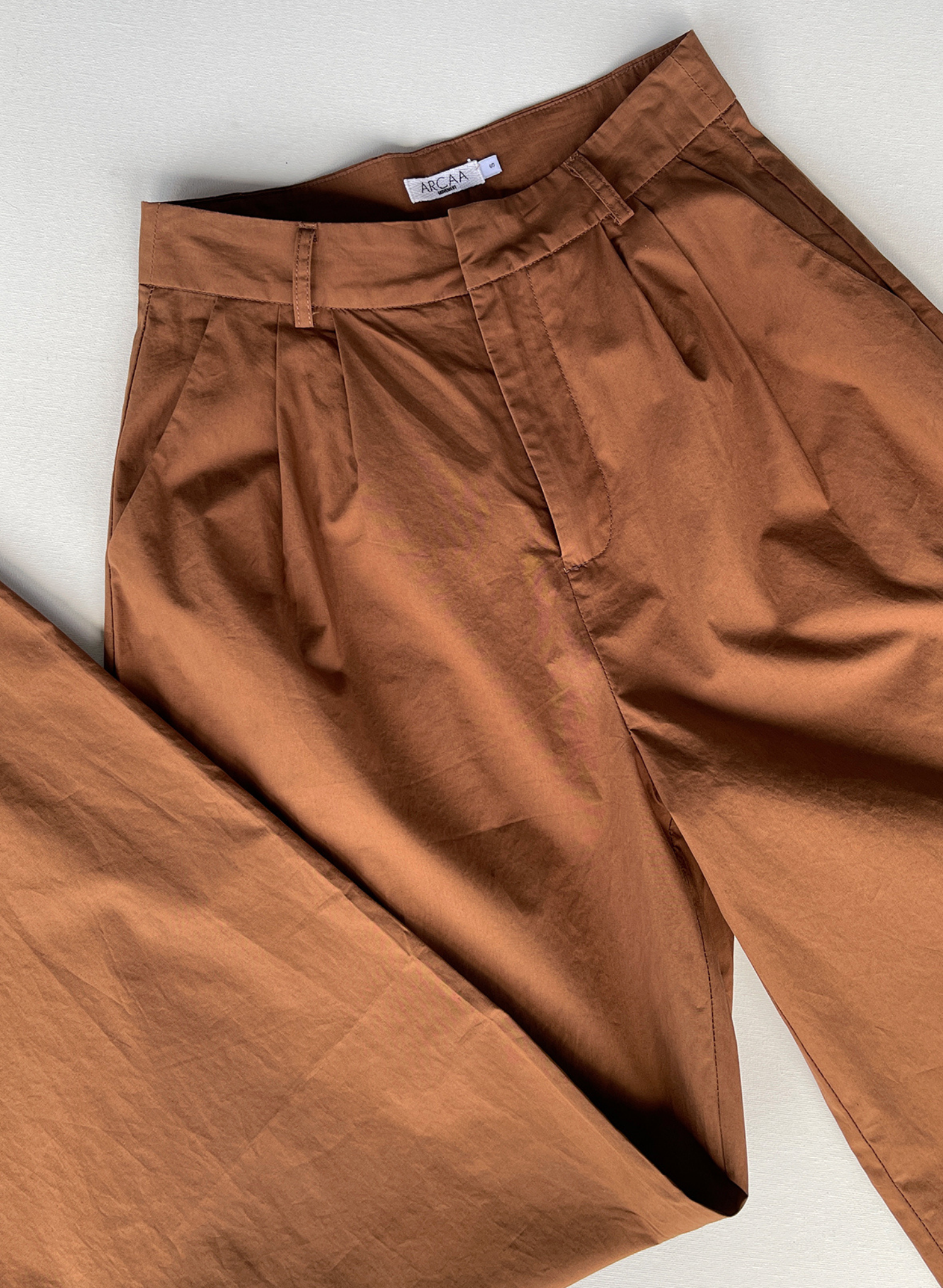 Dylan Pant in Chocolate. Hook and eye front closure with zip Side Pockets Wide leg Tailored fit Premium Poplin Fabric Ethically produced Free of harmful chemicals: OEKO-TEX Standard 100 100%  GOTS Certified Organic Cotton