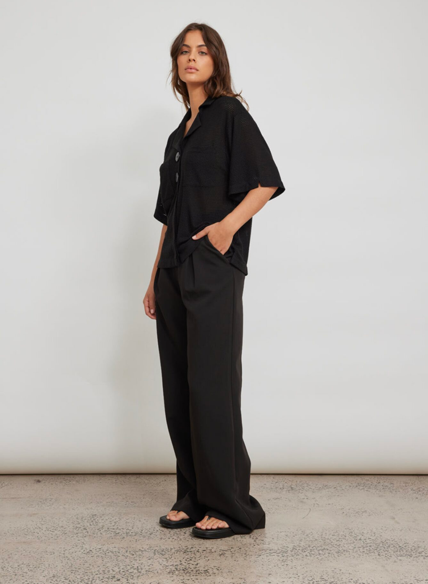 Tailored wide leg trouser Heavyweight suiting fabrication Functional front pockets Large belt loop detail Pant is unlined