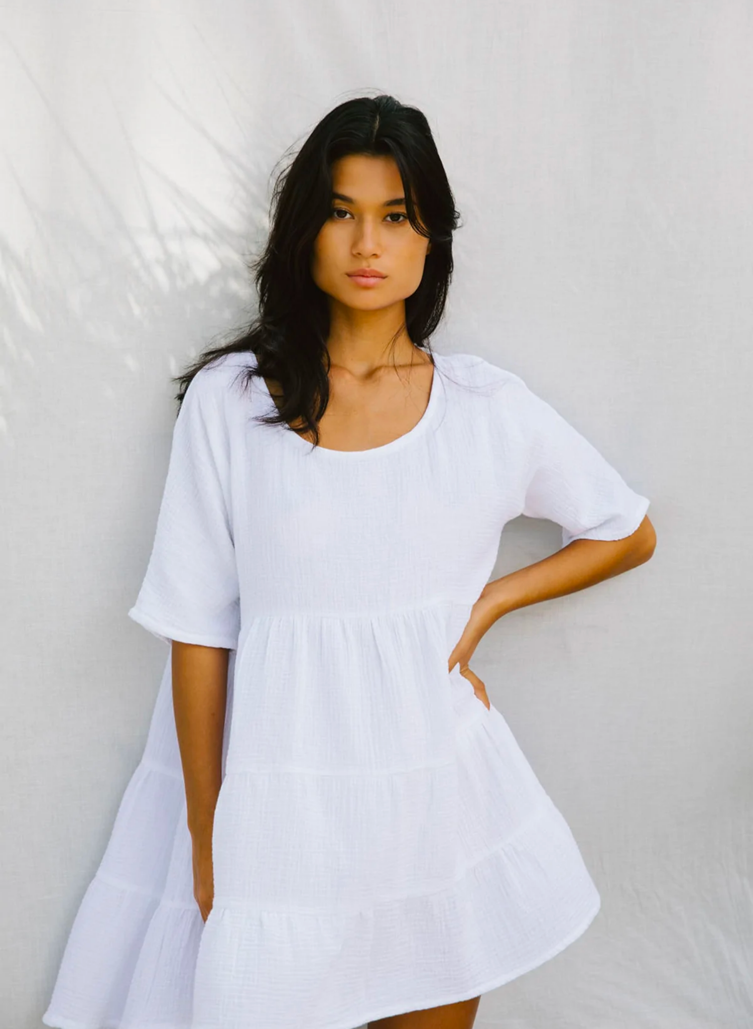 This oversized baby-doll is the perfect chuck on mini dress. Made from the softest natural cotton bubble, you will want to live in this dress all season long.Featuring a flattering scooped neckline a longer sleeve and a tiered baby doll skirt. Paired with sandals or heels it makes a cute day or night outfit.