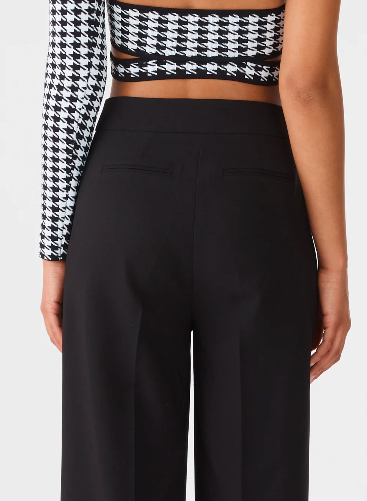 Classic high waist tailored pant, Medium weight woven suiting fabrication without stretch, Pleat front detail, Side pockets, Clasp closure at waist band, zip fly Faux pocket detail at the back 